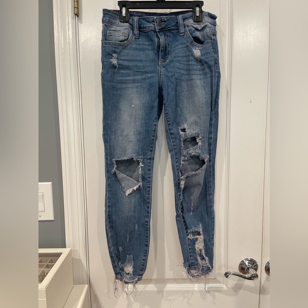 Distressed denim jeans